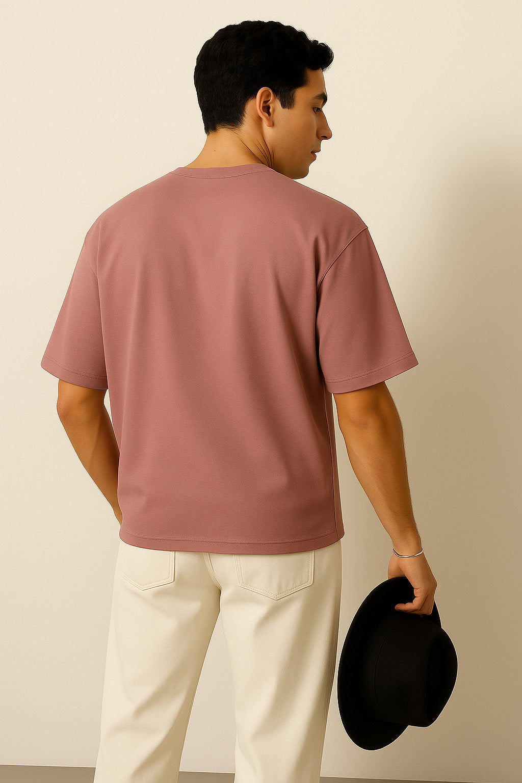 Back side of BANKAZ pink oversized t shirt in solid color and loose fit