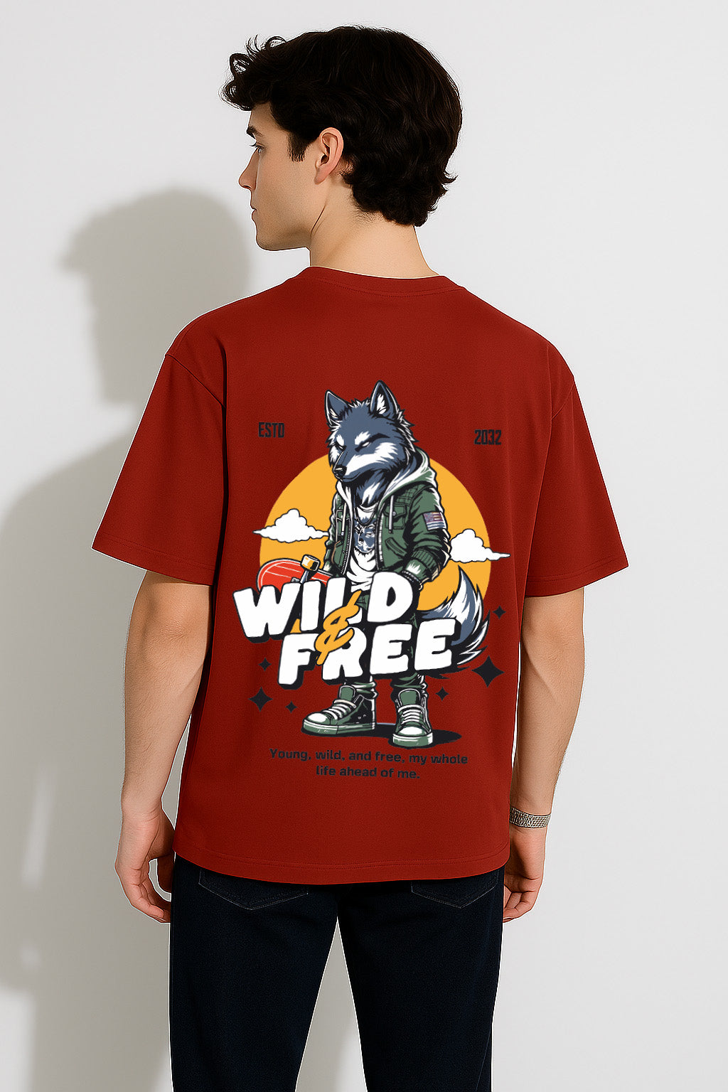 Back view of red oversized t shirt for men with lone wolf illustration and motivational slogan