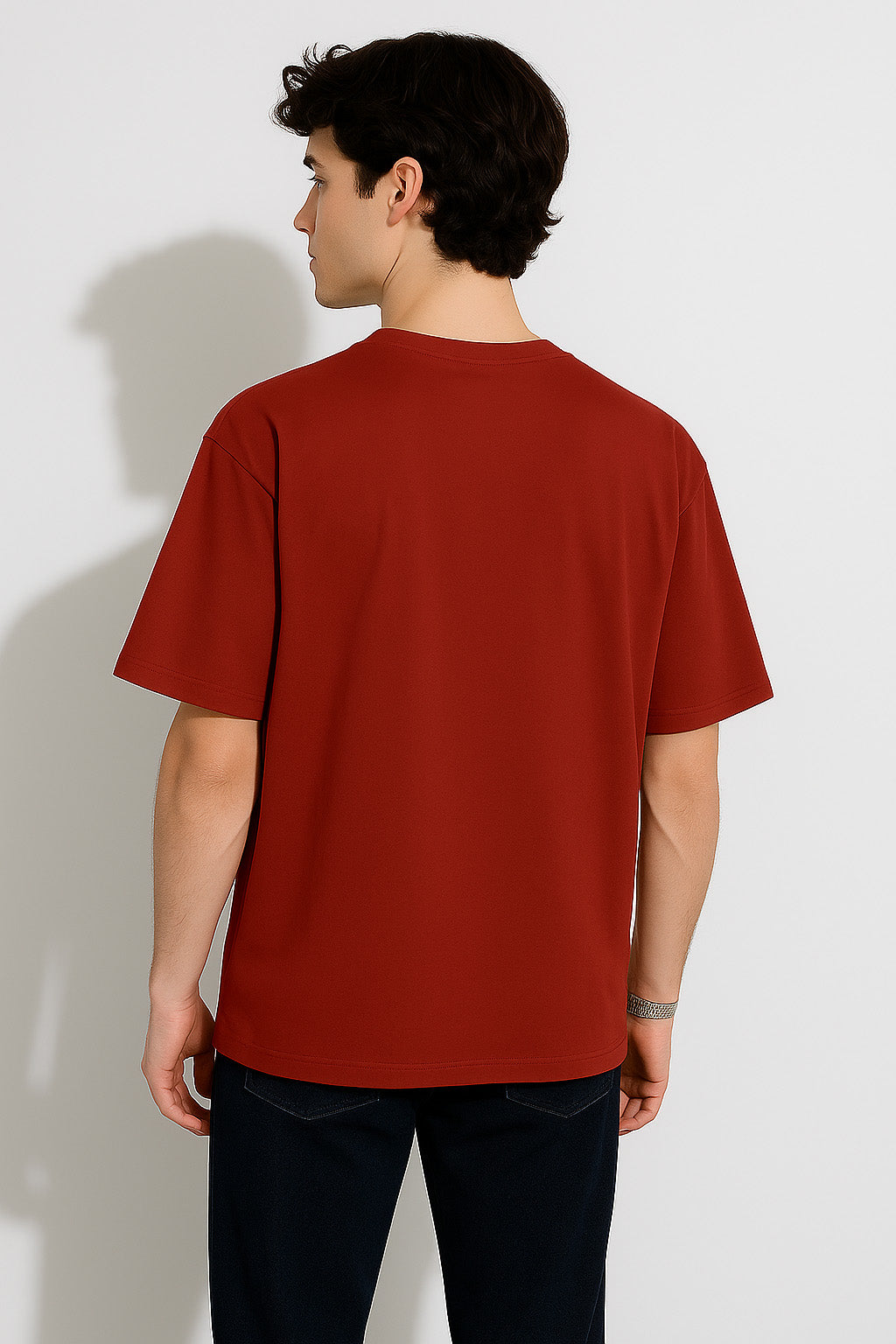 Rear view of BANKAZ red skull t shirt in oversized fit with solid back