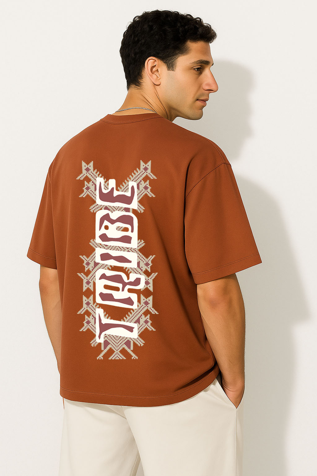 Back view of brown oversized Tribe graphic tee