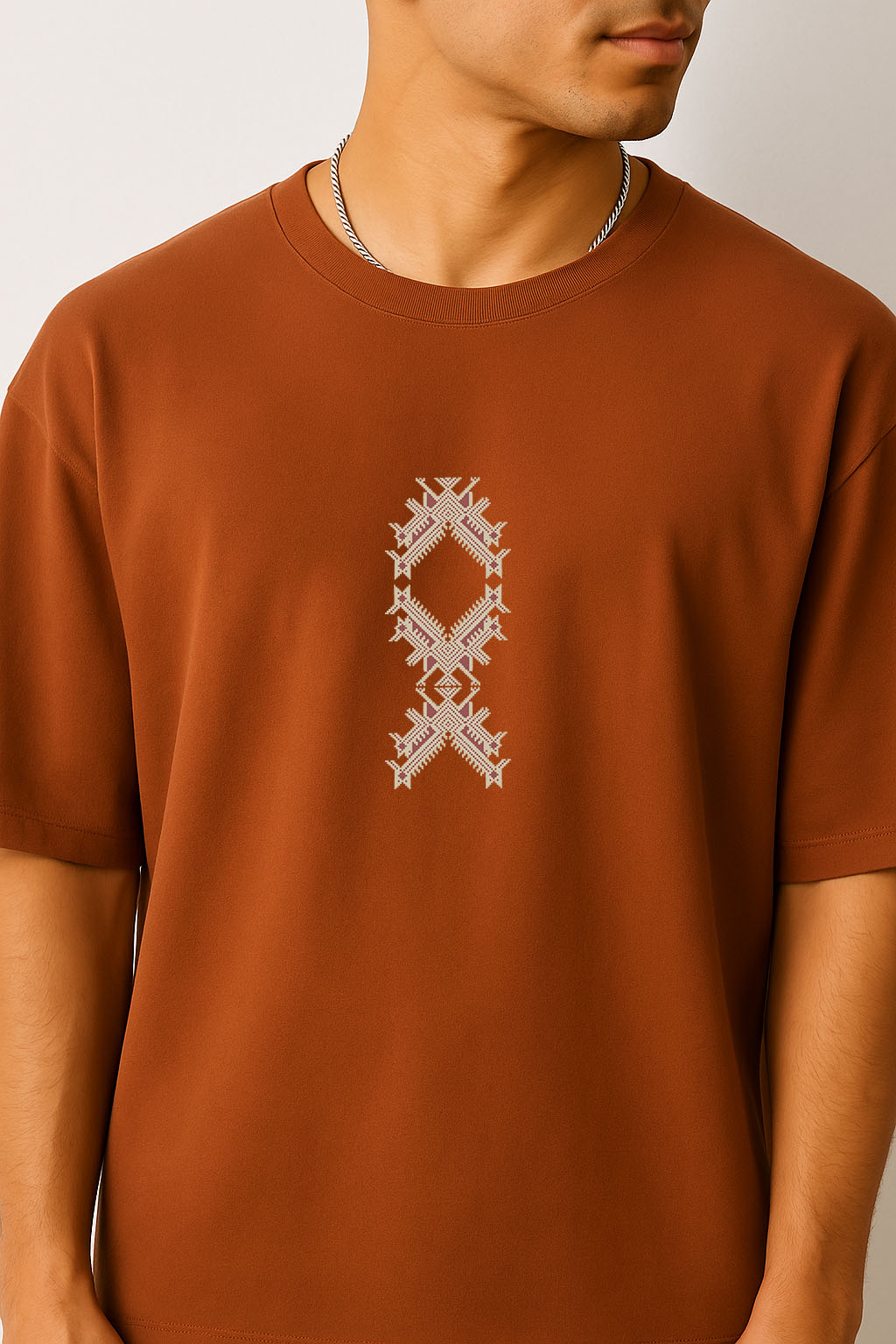 Zoomed front design of Tribe brown t-shirt