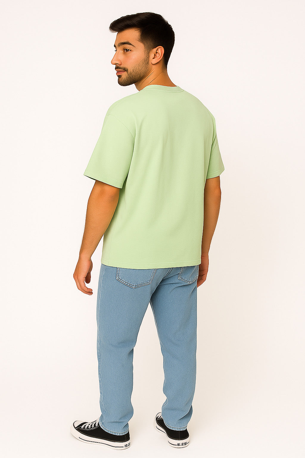 Side-back angle of BANKAZ green oversized gothic black label t shirt showing intricate back design