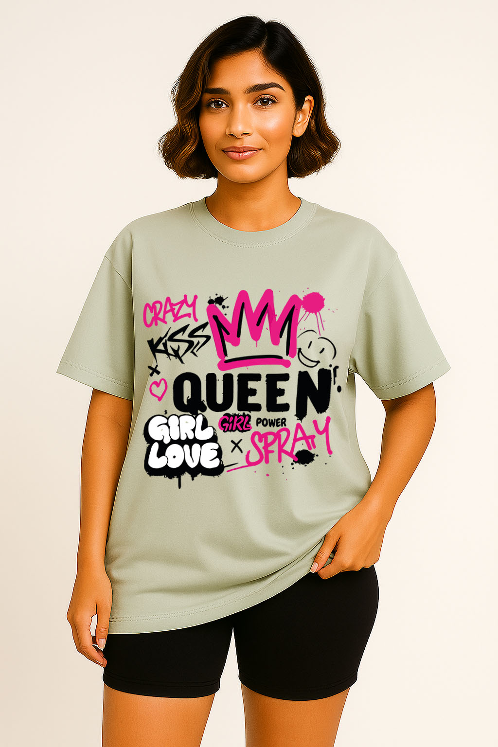 Oversized fit grey t-shirt for women styled with graffiti text and pink crown art – empowering streetwear look
