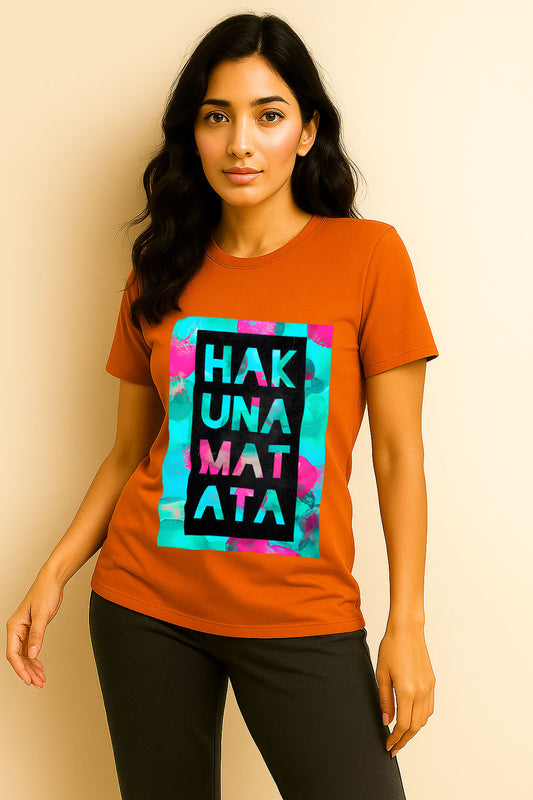 Model showcasing orange cotton t-shirt for women with bold Hakuna Matata design – street fashion