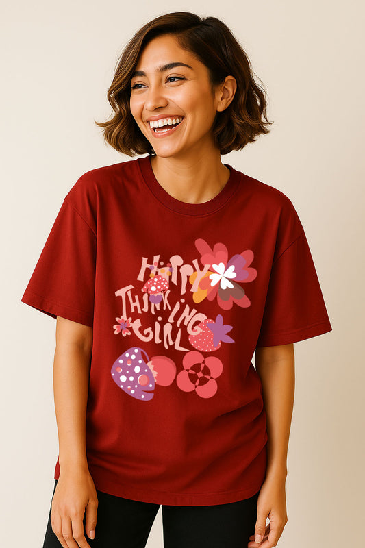 Side pose of woman in red oversized cotton t-shirt – happy thinking girl mushroom print by BANKAZ