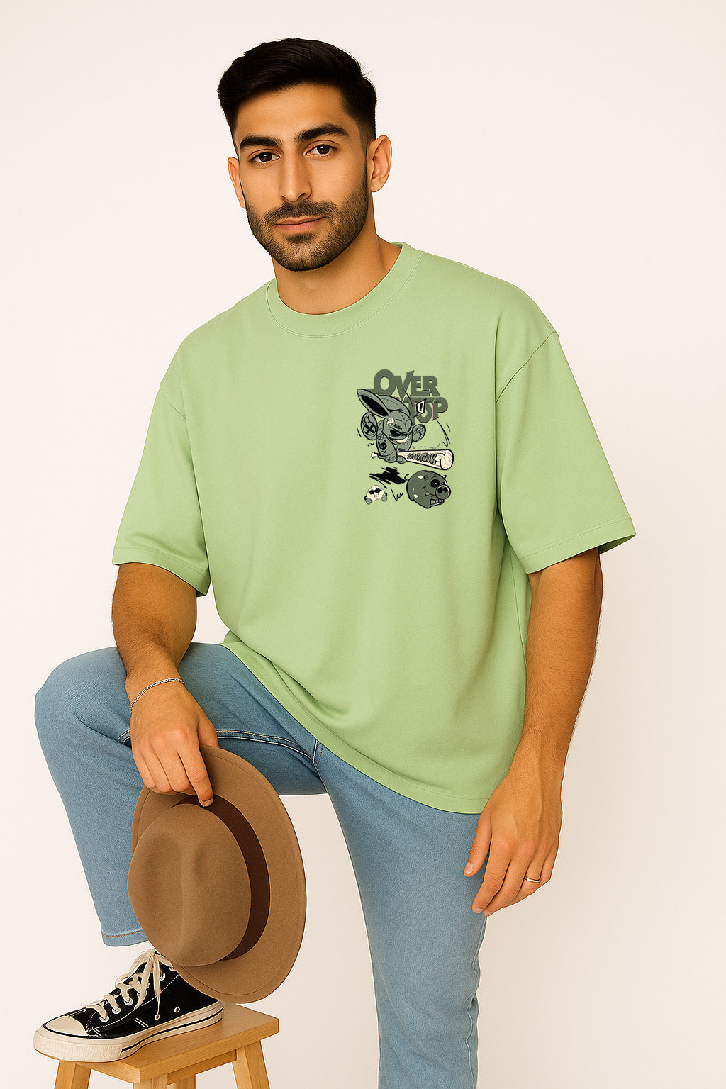 Trendy men's green oversized t-shirt with quirky rabbit cartoon graphic on the front, streetwear essential