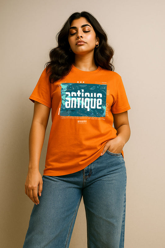 Standing pose in orange cotton women’s t-shirt with antique graphic print – stylish monsoon outfit
