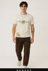 a guy walking to camera wearing Bankaz white regular fit t-shirt