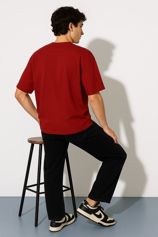 Relaxed back pose showing BANKAZ plain red oversized t shirt