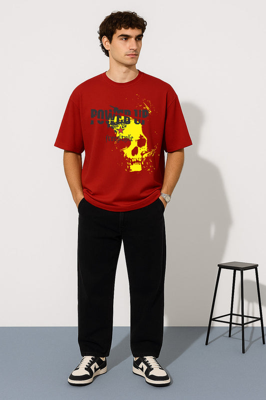 Standing model showcasing BANKAZ red oversized t shirt with striking skull design in yellow and text print