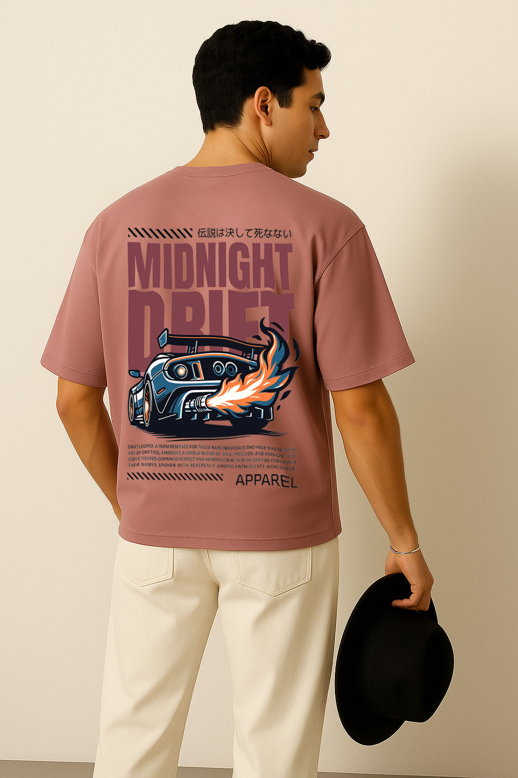 Pink oversized t shirt with street racing theme and drifting car graphic captured from the back