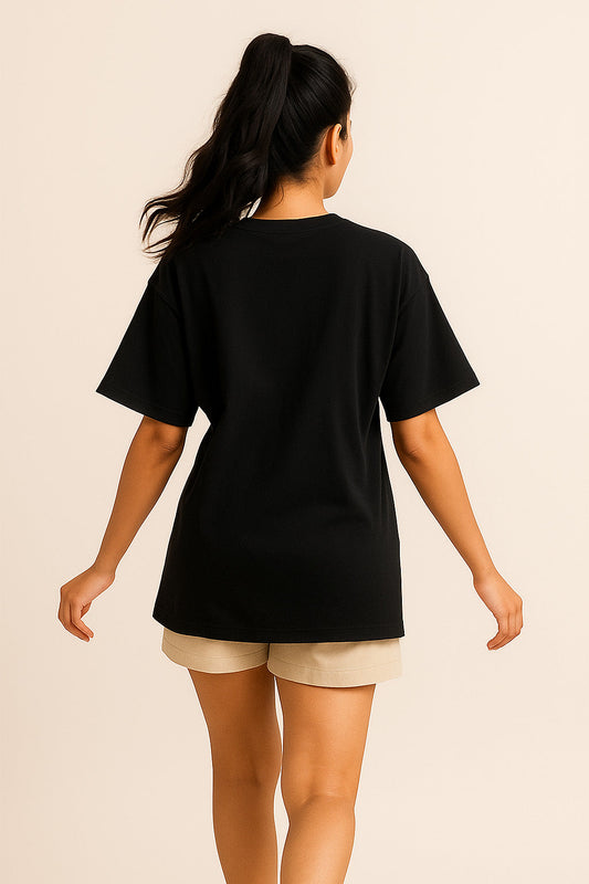 Back view of women’s black oversized t-shirt – cotton lycra streetwear with Gen Z graphic quote print