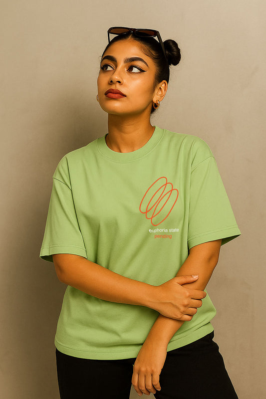 Casual lifestyle pose in Euphoria-themed oversized green t-shirt for women