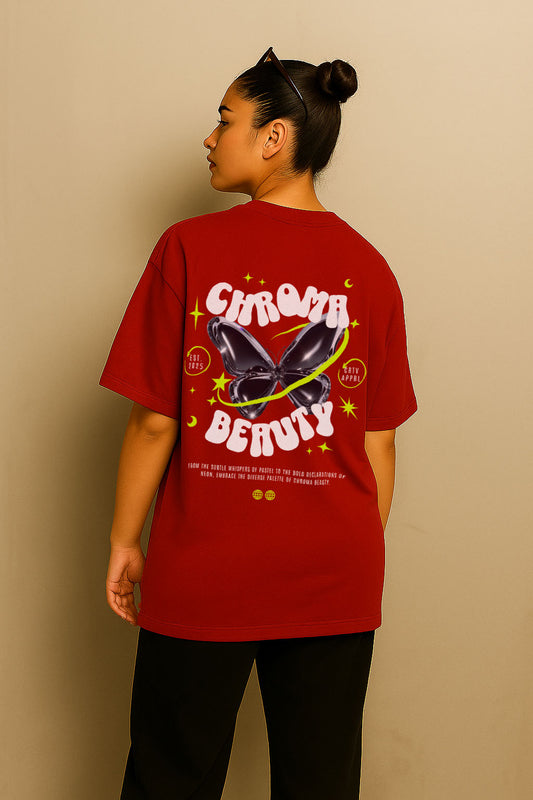 Rear pose of woman wearing red oversized t-shirt with vibrant butterfly and "Chroma Beauty" streetwear print