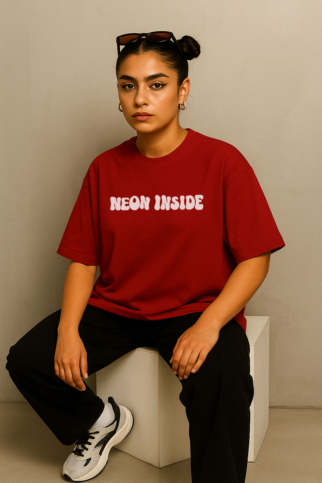 Front-facing shot of red oversized t-shirt for women with "Neon Inside" text – Gen Z streetwear