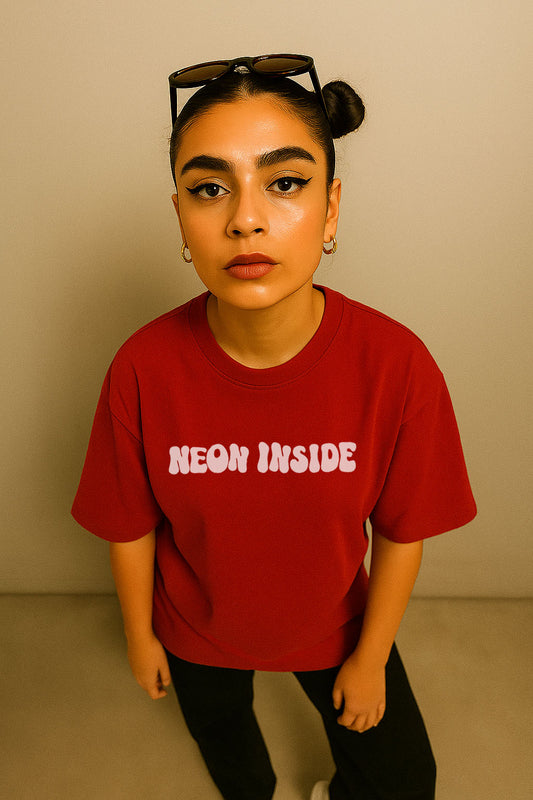 Top-angle view of red oversized t-shirt with "Neon Inside" slogan – cotton lycra fabric for women